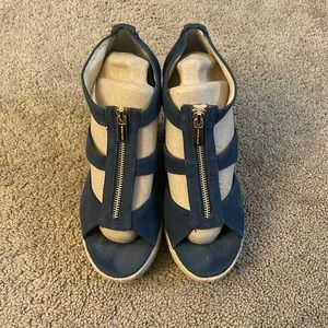 Used Michael Kors Wedges with some imperfections.